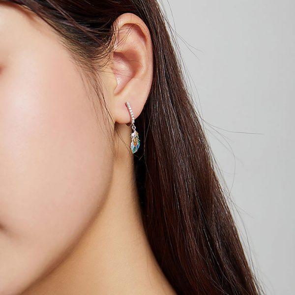 925 silver feather earrings worn by model