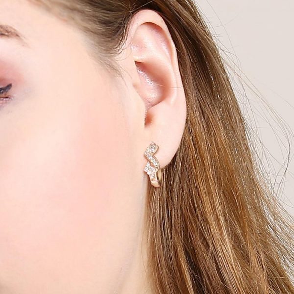 elegant rose gold color cz hoop earrings worn by model