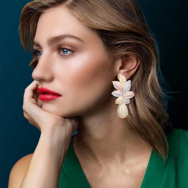 luxury cz leaf drop earrings worn by model