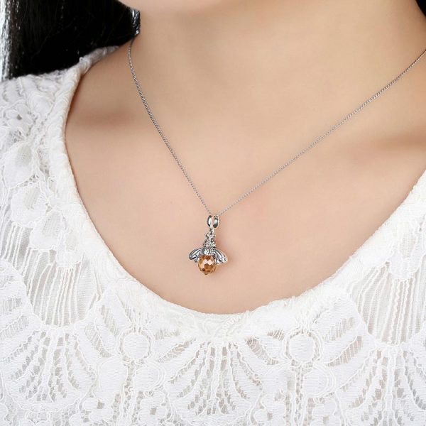 925 silver honey bee necklace worn by model closeup